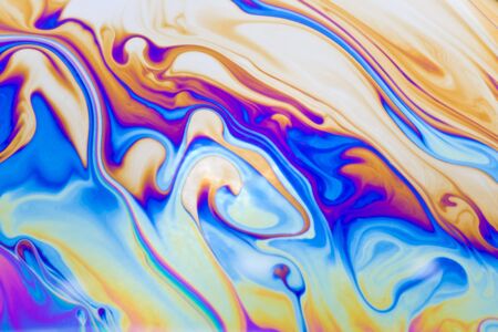 Extreme macro of a soap bubble, with colorful linesの写真素材