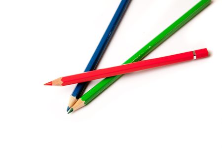 Three children's crayons in the basic colors red green blueの写真素材