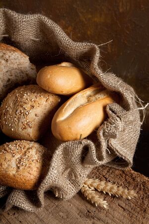 Vintage jute bag filled with fresh breadの写真素材