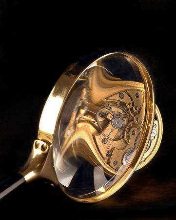 Magnifying glass and antique stopwatchの写真素材
