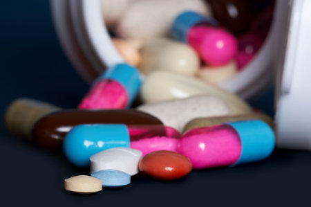 Medicine box filled with coloured tablets and pills