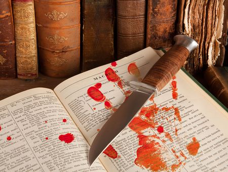 Shakespeare's Macbeth with old books and a blood handの写真素材