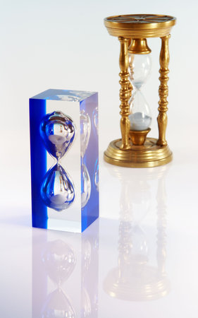 One modern and one antique sand timer