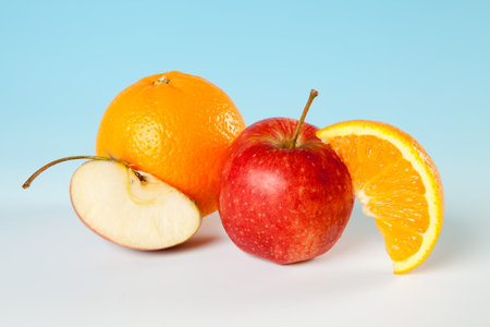 Sliced fruit pieces like apples and orangesの写真素材