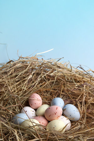 Nest of hay with pastel colored easter eggs
