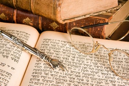Silver Torah pointer lying on a jewish prayer bookの写真素材