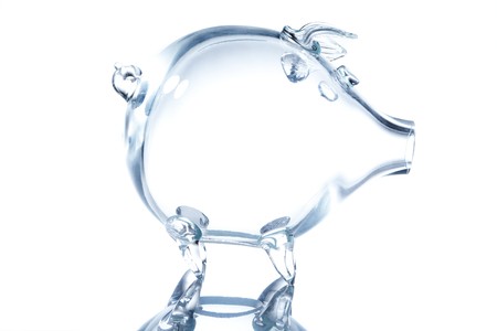 Empty transparent piggy bank isolated on whiteの写真素材