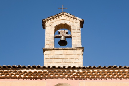 Typical French pastel colored village church bell in Provenceの写真素材