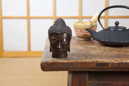 Japanese room with green tea and bronze buddhaの写真素材