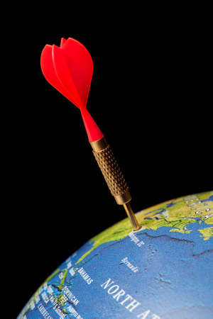 Blue globe with a red dart in the United Statesの写真素材