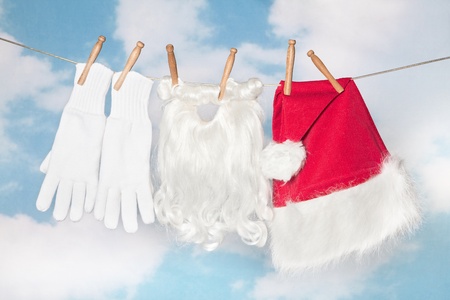Santa Claus' laundry and beard hanging on a clothes lineの写真素材