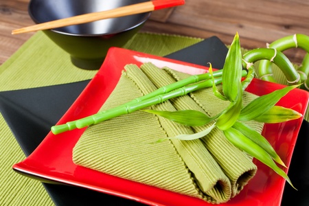 Green matching folded napkins on a festive Japanese dinner tableの写真素材