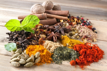Mixture of beautiful spices and herbs on a wooden table Mixture of beautiful spices and herbs on a wooden table
