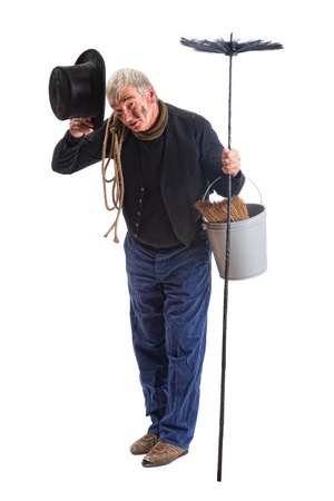 Grungy chimney sweep greeting with his top hatの写真素材