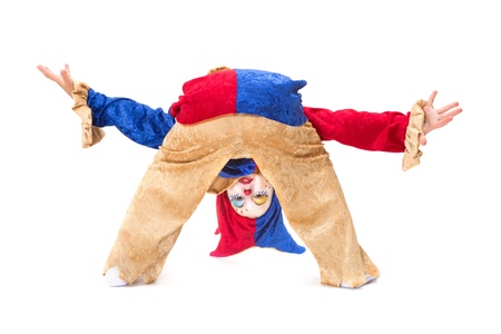 Young girl clown greeting very deep almost upside downの写真素材