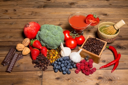Fresh produce on a wooden table all containing antioxidants Fresh produce on a wooden table all containing antioxidants