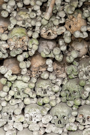 Wall of skulls inside the ossuary of Marville, France, with thousands of ancient skulls of 19th century and olderの写真素材