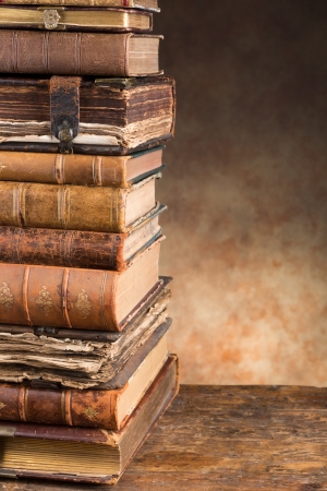 Stacked antique very old books leaving copy spaceの写真素材