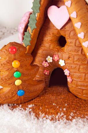 Colorful candy and frosting on a gingerbread houseの写真素材