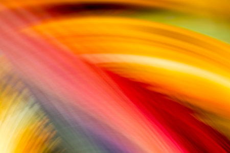 Colorful paper strips in motion photographed without digital manipulation