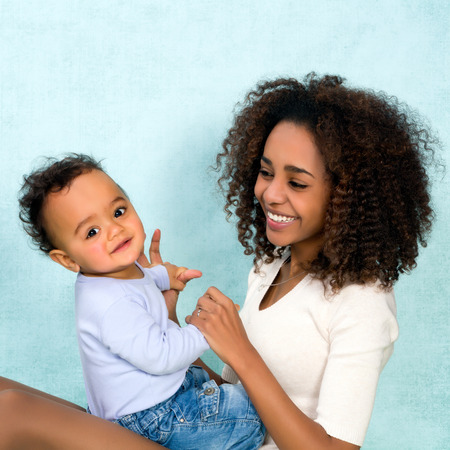 African mother playing with her 11 months old sonの写真素材