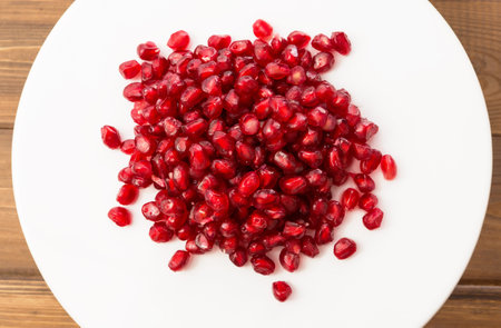 Macro photo of small and fresh pomegranate seedsの写真素材