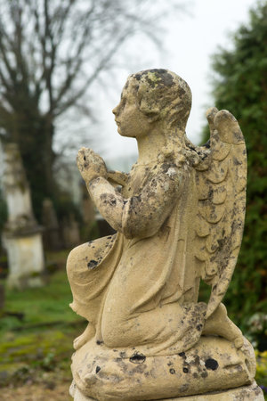 Beautiful little graveyard angel in a medieval French cemetary