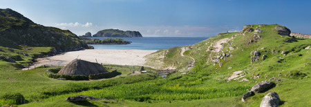 Ancient blackhouse or celtic croft preserved and restorend on a beach on Lewis in the Ouder Hebrides of Scotlandの写真素材