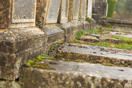 Abandoned old graves in a medieval French graveyardの写真素材