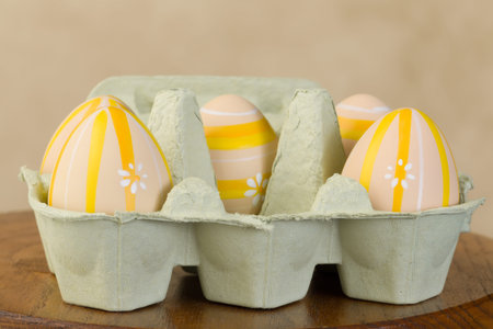 Box of easter eggs leaving one empty spot to photoshop a baby or object in it