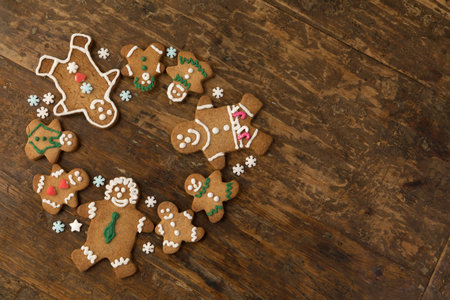 Colorful gingerbread cookies on an old wooden table