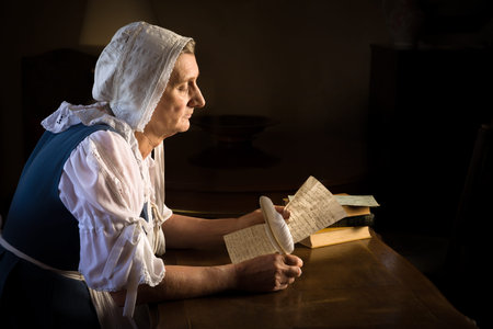 Rembrandt style or Renaissance portrait of a woman writing a letter with a feather quill