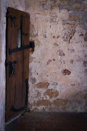 Creepy old cell door in a Flemish medieval castle in Belgiumの写真素材