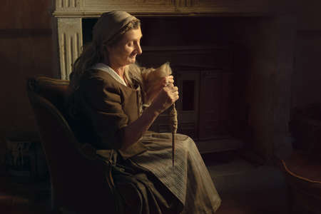 Spinning wool with a spindleの写真素材