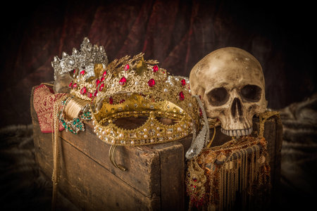 Romantic image of a treasure chest filled with jewellery, precious gems and golden king's crownsの写真素材