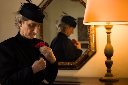 Portrait of a widow dressed in authentic Victorian dress and matching hatの写真素材