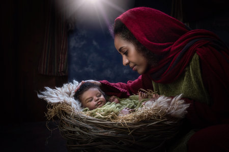 Live reenactment of the Christmas Nativity Scene in an African version with Ethiopian virgin Mary and a black baby dollの写真素材