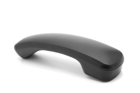 Black nonmobile telephone receiver isolated on white backgroundの写真素材