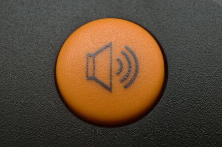 Orange volume button on the telephone macroの写真素材