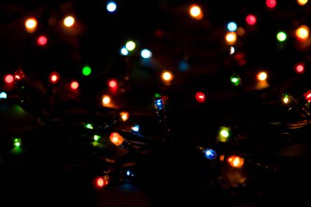 Electric garland colored lamps on dark backgroundの写真素材