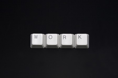 WORK keyboard keys isolated on blackの写真素材