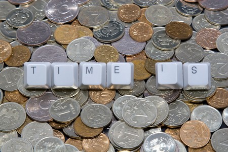 Business concept: time is sign on money backgroundの写真素材