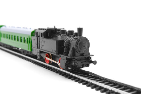 Old toy railroad train arriving