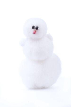 White toy snowman isolated on whiteの写真素材