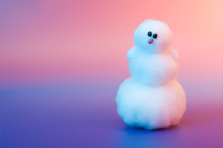 Fairy winter coming - toy snowman in multicolored lighting の写真素材