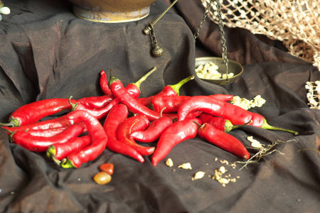 chili peppers on the desk at the ancient oriental shop (imitation of interior)の写真素材