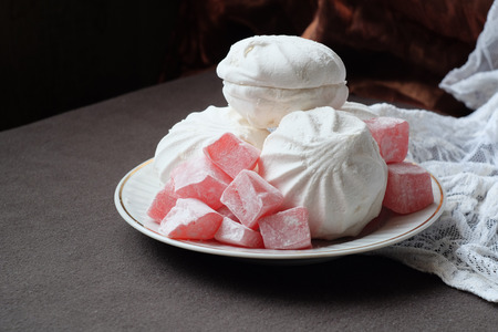 There are marshmallow and Turkish Delight on the plate.の写真素材