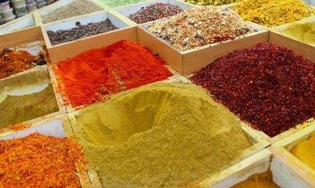 spices and herbs, Multicolored spices in a wooden organizer, top view. Seasoning backgroundの写真素材