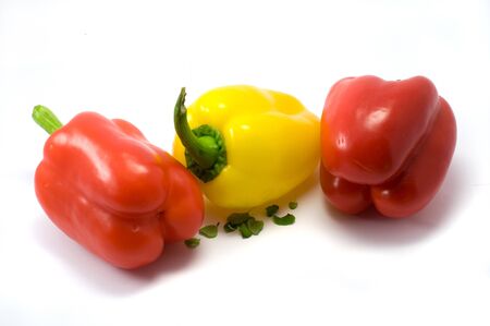 Red and yellow paprika on the white backgroundの写真素材