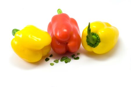 Yellow and red paprika on the white backgroundの写真素材